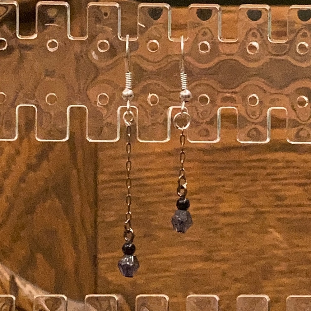 Dangly mismatched sized earrings